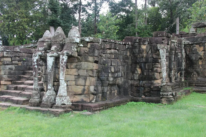 Ancient stone carvings and weathered walls of the Terrace of the Elephants at Angkor Thom, Siem Reap.