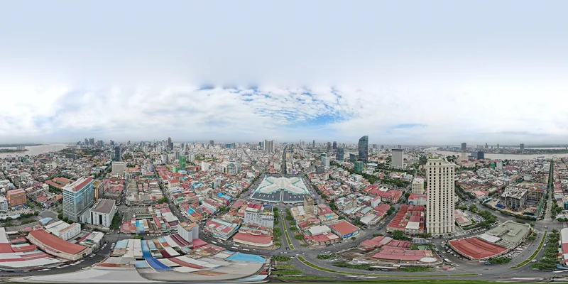 A 360-degree aerial panorama of Phnom Penh reveals the star-shaped Central Market roof amid dense rooftops and skyscrapers.