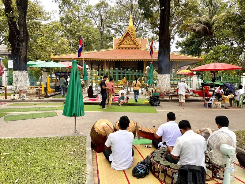 Musicians with traditional drums sit near the Preah Ang Chek Preah Ang Chorm shrine in Siem Reap.
