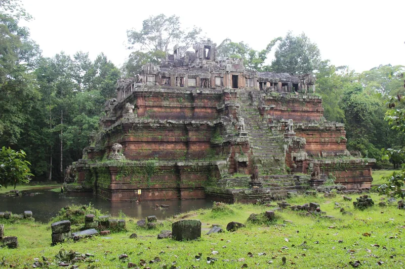 Ancient pyramid-shaped temple of Phimeanakas rises amid greenery within Angkor Thom, Siem Reap.